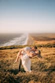 I was apprehensive to purchase this item based on reviews. I ordered it in a large and absolutely loved it! The skirt fit perfectly on my hips, and you can tighten or loosen the top with the back. I wore it for engagement photos and they turned out amazing! Couldn't see through the bottoms either. - Stephanie K.