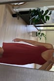 I love this dress! It's soft, casual but sexy too. I can wear it doing errands with flats or booties, or wear with sexier high shoes and jewelry for dinner.  It's a pretty, light rust color.  I wear the silicone adhesive bras stickies with most of my tops and dresses including this one as a bra won't work. The fabric shows any and all water or oil spots! I can't even use lotion, silver it transfers to the fabric. Also, not hemmed at the bottom. Lulus please offer hemmed clothes! Otherwise I love it. - Rosalee M.