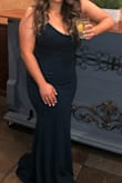 I purchased this in two sizes for a wedding. I ended up wearing the M, as I ended up liking the tighter fit more and didn't find the need to wear a bra with it. Of course, it was too long, however with my heels it was a good length. The material was extremely forgiving and fit like a glove. I got so many compliments on this dress. I tried to order the same dress in a different color for another wedding, but there is none in my size. Well worth it and highly recommend! - Stephanie G.