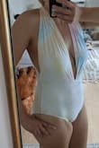 This swimsuit is now my new favorite one piece. It fits my long torso perfectly and it is made out of a super soft and stretchy material. it feels very comfortable and secure while being sexy. LOVE IT! - Christie S.
