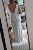 The dress is beautiful and not too heavy even though it is fully beaded. The Large was too big on me everywhere. - Christie S.