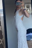This dress is incredible! I bought it for our 10-year anniversary vowel renewal and photoshoot and can't wait to wear it for that special day! I was so impressed by the quality and fit when it arrived and loved the inclusion of a traveling dress bag. I'll have to have it taken in in the bust a bit, but other than that it fit like a glove. I love that it has just enough stretch to hug curves in the best way. Highly recommend - Rochelle S.