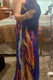 This dress has zero give. I wish there was a little stretch. The under skirt is short and the dress is shear. It's gorgeous and low maintenance. I do need a new more shear bra. Perfect for family beach photos, as well as fun outings. I may invest in a little tailoring in the straps. The length was ok with shoes. This would make a good dress to roll and and use for travel. - Trisha E.