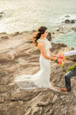 This dress was perfect for my beach wedding. The back straps make it adjustable and I ended up shortening the inner layer, while keeping the outside lace layer as a mini train. It's sexy, fitted, and easy to dance in. - Fariba A.