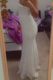 The dress is perfect. One thing though in this picture I didn't have heels on. With heels the front is a little bit short which was a bit disappointing but it's okay. 

I love this dress!! - Peta P.