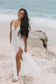 I loooove this dress. It's the best beach elopement dress I tried on! If you're gonna have a very formal church wedding, this isn't your go-to. It's a leotard underneath and so sexy and romantic! It was long for me I just hemmed quite a bit at the bottom. - Kleine S.