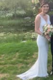So up until 2 weeks before my wedding date, I had planned on wearing a different dress when I saw this one. I took a chance and ordered a small and extra small and the extra small fit best!

Alterations were done in a week and I was able to have neckline and straps taken up as well as waist taken in so alterations are possible even with the beading! Also had a bustle added - the train is small but it definitely helped move around!

I felt beautiful and elegant on my wedding day and everyone was so impressed when I said my dress was from Lulus. I 100% recommend this dress! - Liz P.