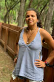 I got lots of compliments when wearing this blouse, it's perfect for summer and gets along very well with shorts or skirts, I love the back and the side cuts. I'd say it's sexy without being vulgar. - Caren C.