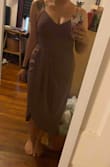 I bought this dress for a friend's cocktail wedding because I loved the style and color! I am an athletic build with a bigger bust so I always fall somewhere between a large and  medium. This dress is structured so it was tight around my rib cage but I was still able to breathe easily and move freely. I went with no bra and only Breast tape and felt totally secure! I do think I'm gonna go with using fabric tape on the skirt, because it does have a high slit when sitting down! I did have some struggles with the zipper, it took two of my friends to zip it up all the way. - Angela C.
