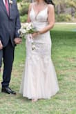 Loved it. But it is more off white than white. It was a little long so I had it cut by a tailor / seamstress. Beautiful fit and I received so many compliments. - Tracy B.