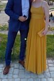 I wore this dress for what I believed was a fancy birthday dinner, but turned out to be a surprise proposal. So this dress holds a lot of sentimental value to me now. It's really beautiful, I had it hemmed about 2 inches on the bottom (wore 2" platforms as well) and added a stitch in the front, so the slit stops about 4" down. Only complaint was it was a little loose in the bust, so I had to be careful leaning forward, but that's easy enough and it fit perfectly while standing. I got complimented on it all night, if you want to feel stunning and stand out while still being comfortable, this is the one. - Elizabeth B.