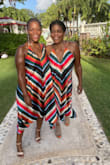 My mom LOVES to match so she chose these for our beach wedding guest attire. She saw it online and said, "It's so 70s and colorful. We must get them!" I obliged. And I am so happy that I did. I LOVE, LOVE, LOVE this dress (we both did). I usually wear a medium in dresses and my mom usually wears a large, however we both order smalls and were more that pleased with them. It's very flowy and flattering so you don't need to size up. We received so many compliments. The dress is just STUNNING. Please do yourself a favor and order it. - Brittany T.