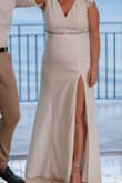 I loved how lightweight this dress was and the price! It was very comfortable and I wore it for our wedding in Mexico (in July). I loved the slit in the leg and the back. The material is silky smooth on the inside so it felt nice to wear. I didn't wear a bra because of the back. - Bre P.
