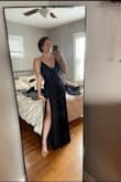 I love love this but a heads up the straps aren't adjustable and the material if the straps/top stretches which could leave room for some *slips* I am going to have the straps altered and pants hemmed (they're a tad long But I'm also short) overall it is gorg! Love the double-slit! - Katie R.