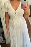 I'm between 5'3 and 5'4 and Lulus maxi dresses are always way too long on me! I think it would have been okay in heels but that wasn't the issue here, the dress fit basically everywhere except my chest, which was too small. And it's too small ONLY because there's a little snap enclosure to create the V-neck and it's placed very awkwardly and made the dress pull right at my boobs. With the snap undone the top of the dress was super loose so it's not like the dress itself was too small. Maybe if I had the time and patience I could have taken it to a seamstress to place the snap enclosure lower down or something, but I just returned it. Also I wasn't a super huge fan of how the material overlapped at the waist and showed through. This probably is only an issue on the white because it's a little sheer (my fiancé told me he could see my blue underwear from the back, so just a heads up there). - Hannah S.