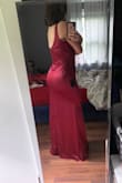 This dress fits so perfectly it feels like it was made for my body! The satin is gorgeous and comfortable. There's a tiny bit of stretch so I can sit without being squeezed. The style of the V neck line and back is subtle but really makes the dress looks beautiful while wearing. I wore 3" heels with it and I could have it altered a half inch to make it perfect but isn't totally necessary, I can walk without tripping or picking up the dress! I love that the burgundy color has a pink to it! I wish it came in every color! - HannaH L.