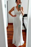 I was overall so happy with this dress. It looks gorgeous on, although very tight fitting. I am a UK size 10 and M fitted me great, but it was long and I did need to wear very high heels. It wasn't easy to tailor either due to the beads and positioning of seams. I am 5ft 3, so would perfectly fit 5ft 5 or slightly taller. Some beads did fall off, but to be expected. - Emily C.