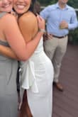 Loved this dress. Wore it for my rehearsal dinner! The slit definitely goes very high in the front so you have to be aware of that. The front is not see through, but I did wear spanx because the back was not as solid. It is comfortable and stretchy! Highly recommend - Sabrina P.