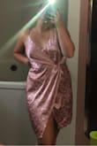 Super cute comfortable dress. If you're in between a medium and large order a large. The only problem is the cross in the middle does rise a little high but nothing some dress tape can't fix. A little dark pinker than advertised but still cute. Love this dress! - Emily N.