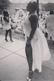 This dress was purchased for an all white affair and it did not disappoint. I ordered an XL and was worried it may be a little tight but it fit perfectly. I lace detailing on the bodysuit gave it just the right amount of elegance and the side splits made gave me opportunity to show off my legs. Only issue, the dress is not "paper white" it is more of an off white. - Nefertari W.