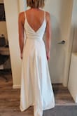 I love, love, LOVE, this dress! The top fits me perfectly, really feels like it was made for me which I haven't found in any other dress I've tried. The quality of it and the ribbing in the top make it feel like the $1000+ dresses I've tried in boutiques. The slit goes allllll the way up so I will be having a stitch or two put in so I don't flash my guests on the day. Great length for taller brides, I'm 5'8" and can wear tall heels with this as is, shorter brides will definitely need it hemmed. Hoping to get the back altered to be a low back if possible. Very happy with my purchase! - Ciara O.