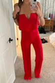 I haven't worn a lot of jumpsuits in my life, but I wore this to a wedding and received so many compliments (more than I have ever received). Based on reviews I couldn't decide if I should get a small or medium as I am typically in between sizes. I initially ordered small and it fit well everywhere but was just a little tighter than I wanted in the hips and butt, so I exchanged it for medium which worked out great. It is super long- so if you are shorter you most likely will need to get it hemmed as I did get it a little dirty on the bottom being at an outdoor wedding due to the length. However, it is beautiful and I am tempted to buy it in more colors for sure!! Order this! - Kristin M.