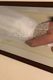 The dress was a little bit of a lesser whiter color and the padding was super dark. I loved it once I put it on. However, I wear a street size 6-7. I ordered a size 10 and it barely fit over my hips. The top would not zip up at all in the back. Would be a great dress for someone smaller. The tulle is a little too poofy for my liking, but overall it was a nice dress. - Shelby V.