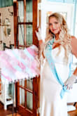I wore this to my bridal tea party shower. It was amazing it fit so good. Definitely a show stopper. Back is low but not to low for a power short. Material is thick. Straps good length. I wore 5 inch heels and I'm 5'3 and a half and the dress touched the floor in the front. It has the lace train which obviously drags but you could alter if needed I like trains though. Oh I added a bridal belt from Lulus to accent the waist. I really didn't need it once I saw how the dress fit  but bought it with the dress and it was super pretty! - Katy A.
