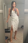 Decided to get XS since I'm petite and it was the perfect length. I wore this to a funeral where we were to wear no black. It looked more modest on me since I'm short and it hit mid calf and the slit wasn't too revealing. The adjustable straps helped a lot. Wore it with nude strappy heels. Would also be perfect for daytime weddings or bridal showers! - Jessica S.