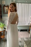 This is a lovely dress that daughter will wear on her weddings day on the cliffs of Ireland. O thing extravagant she said. The dress has lovely form  with a beautiful low cut back. - Heather F.