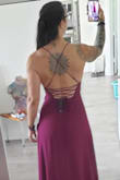 Loved how classy it looked. For the most part, the material is soft and comfortable. 

Cons:  the shoulder straps where Horribly uncomfortable!!! They are so thin it felt like razor wire digging into my traps. I had a red scratch there the next day.  They are adjustable but when I loosed them it made the cups too baggy and my boobs fell out!!!

Which brings me to my next con. I love showing some cleavage but I couldnt keep the girls contained in this thing. I wore pasties under to avoid any woredrobe malfunctions, but the whole night I had to keep checking to make sure they were still in place.  Anytime I bent over or twisted I was in the brink of exposing myself. 

If I wore it again I'd get it tailored to bring the V up higher and replace the shoulder strings with silk or something softer.

Please keep un mind that I have a very athletic upper body and large breasts (32G). - Heather C.