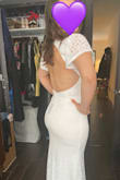 The dress is beautiful and well-made. The top is supportive (I wouldn't need to wear a bra with it). I loved the way the back looks, but I think it's too tight across the hips and makes me look wide. I will be returning this, sadly! - Claire S.