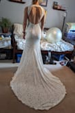 Love the material and fit of this dress! I ordered a small. It has a little looseness/pooching on one shoulder but that could just be my build and can be altered! The dress is slightly tight in the hips, but I'm certain a Medium would be too big based on the fit of the Small. So comfortable! - Hannah S.
