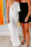 I LOVED THIS JUMPSUIT. I would actually live in it. It is super comfortable and the material is very forgiving and easy to move around in. The top does not slip at all. I think it would be amazing on all body types. Everyone needs this jumpsuit! It's the perfect length for my long legged friends. It's so easy to dress this piece up. - Natasha B.