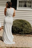 This dress is absolutely gorgeous! It fit like a glove. The only alteration I needed was a hem just in the front because the back already has a small train. I bought this on a whim and now I am adding a second look, and if I didn't already have a dress I had custom made, I would just wear this one from beginning to end. The only thing to be aware of is that it sheds sequins. But, it is so classy and flattering. - Ashley F.