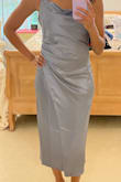 This dress is a beautiful color and material. However, I didn't like the way it fell on my abdomen. I thought it would conceal my stomach, but it had the opposite effect. - Nicole C.