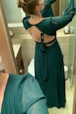 The dress itself is beautiful, perfect to wear for my sister's wedding as maid of honor. I have an athletic build though and while the size is definitely the right one for me, I have a lot of extra room in the belly/hips and would definitely have to get it hemmed if I wasn't wearing 4 inch heels (not too big a deal, makes it extra swishy) but can't really lift my arms over my head because the proportions just weren't made for me. So if I went to a L it would look much too large but if I went to a S I'd probably rip the armpits just reaching forward. It looks good though, and is warm enough to wear outdoors in WA in mid October. All in all I'm happy with it but it would be a little more flattering and comfortable if I'd been able to give my specific measurements.

I do love the back, and the neckline is quite flattering. It would work even if I had much bigger breasts too (oh well, they have tape for that) - Maya C.