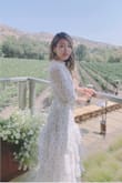 This dress is so beautiful! The fabric has intricate details on it and doesn't get too wrinkly. I absolutely love how feminine it feels and will bring it to Europe with me next time we can travel. - Daphne X.