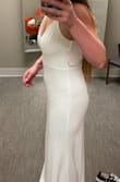 The fabric is thicker than I thought. I was a little nervous to order such a form fitting dress but the material isn't clingy. It is soft and stretchy and very forgiving. The straps are adjustable which is helpful but I am getting them altered so it looks more expensive. The length is extra long!  I'm 5'8" and it was pooling at the feet. - Megan P.