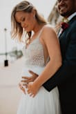 I ordered this dress last minute for my wedding reception when i realized at 4.5 months pregnant i would not fit in the dress i wore at my small ceremony last summer. This dress is absolute perfection! So comfy and everyone commented on how flattering and expensive it looked. I truly couldn't be happier, especially with the price point. - Brittany S.