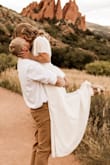 This was absolutely perfect for our wedding! I did get it hemmed about 1/2 an inch? I wore a wedge shoe with a thick heel! - Lacey T.