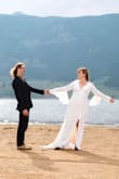 I bought this dress for our wedding photo shoot, after we eloped last year. It fits beautifully, hugging in all the right places. The sleeves and slit make this dress interesting, and it photographs super well. I looked at this dress a lot before I bought it. If you're debating whether or not to get it, go for it! - Taylor W.