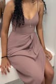 I ordered a bunch of dresses for a wedding and this was my winner!! I felt like a million bucks in it! Such a beautiful color and perfect length! Top part was very tight. I had to go braless but the material is thick enough that it wasn't a problem. If you are bigger than a 34C, SIZE UP. I was at the threshold of a S being just tight enough without being uncomfortable. The material doesn't stretch at all, but straps are adjustable. If you are curvier than me I encourage you to size up! - Bana I.