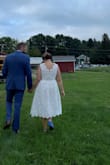 This dress was perfect for my outdoor, small, beer garden wedding in August. I wanted something short and classy and it certainly fit the bill. Ordered a L and a M, but the M was a better fit. It was a little snug right around the waist/belly button, but loosened up after having it on for a little bit. I didn't do any alterations, but could have taken the shoulders up just a bit. It was longer than knee length on me, but worked okay. Can't really be shortened because of the hem. Pockets were a great addition, just not a super sturdy fabric for anything heavy (worked great for a hanky and my vows!). We didn't end up using the hook on the zipper because it fell funny when zipped up. I also could wear a normal bra with this dress, which was a huge plus. I got a TON of compliments on it and it was so so comfortable (my mom remarked that I didn't pull at it once all day and I had it on from 2 - 11 pm! - Kerry S.