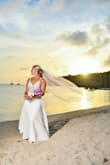 My husband and I cancelled our big fall wedding and decided to elope to Saint Lucia this past summer. I wanted something lighter and breezier for getting married on the beach in the hot sun. I ordered this and it was nothing short of perfection! It was easily tailored to be shortened--that was it! It was comfortable and just the right amount of glam. You don't even notice the beautiful detail of the beading until the sun hits it just right. I received so many compliments on it! It was easy to transport carrying it all the way from Chicago to Saint Lucia and back. It was my true dream dress! - Samantha P.