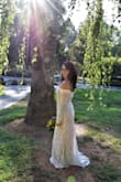 Bought this in a scramble for my elopement and it was perfect! My now husband loved it and it was well priced. It photographs so well! The sleeves kept falling down after a bit of movement so I did have to pull them up on and off but nothing major. Very flattering dress! - Melanie G.