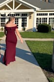 The quality and color of this dress is amazing. The material is a little thicker but has some stretch. I normally would wear a L but sized down based on other reviews. Received many compliments, perfect dress for many occasions. - Shawn F.