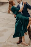 The color of this dress is amazing. Wore it for our engagement pictures and I LOVE. Great quality material but will wrinkle easily. Must buy! - Emma F.