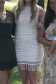 I loved the idea of the dress for my bridal shower. Our wedding is boho-themed in October so this dress fit the vibe well. Nice material quality. It was a little unflattering in the stomach area, even though I'm relatively slim. In some lighting, it looked like I had a bump which I didn't appreciate lol. The fringe added some additional length since I'm tall but still pretty short and hard to sit in the dress. I think it would be beautiful on a different body type. - Olivia K.