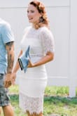 The fabric of this dress is super soft. It really is lovely. I did buy a shapewear slip to wear with it, to avoid the sun shining through it and keep everything smooth, but it isn't 100% necessary. I was actually surprised how comfortable it is. Got it for my engagement party. I highly recommend it. - Nicole M.